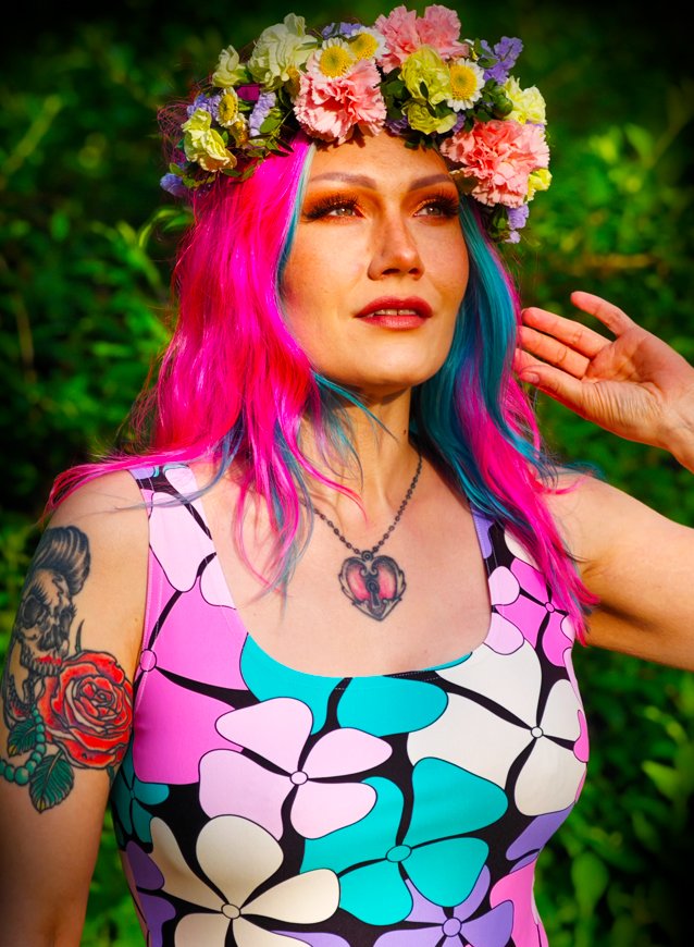 Lady in ADELIE pink mint skater dress, flowers in her hair, dreaming of summer.