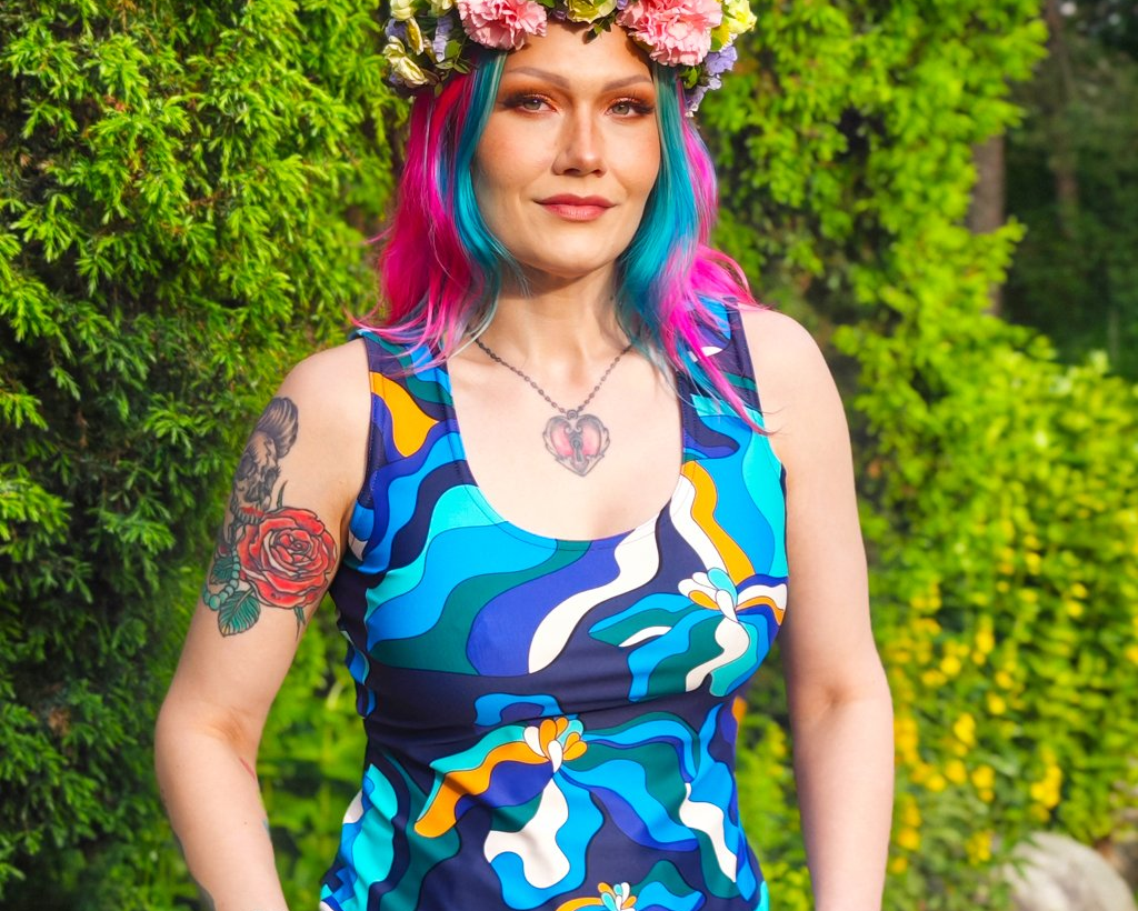 Woman in a colorful tank top by SHALMIAK.